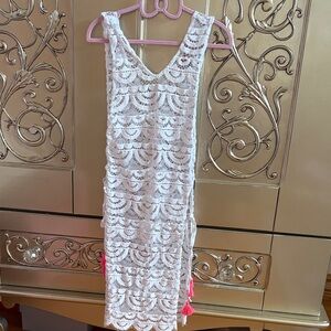 PilyQ White Lace Cover Up Dress features pink tassle accents.